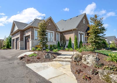 Front yard and walkway landscape design in East Garafraxa by Tumber & Associates