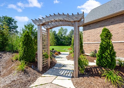 Front yard and walkway landscape design in East Garafraxa by Tumber & Associates