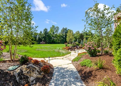 Front yard and walkway landscape design in East Garafraxa by Tumber & Associates