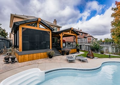 Backyard patio and pool area landscape design renovation by Tumber and Associates in Orangeville