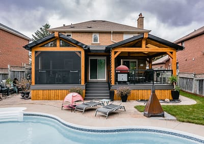 Backyard patio and pool area landscape design renovation by Tumber and Associates in Orangeville